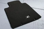 Genuine Nissan Floor Mats Carpet Metal Logo 999E2-ZV002. Fixed Price $140.12.